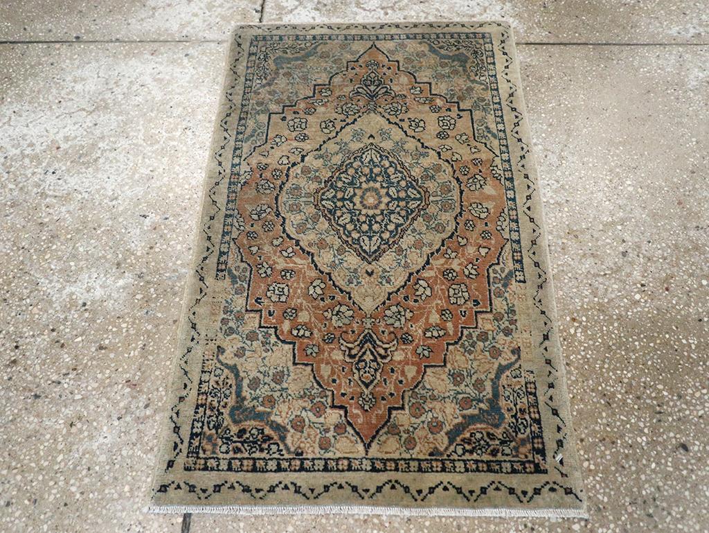 This early 20th-century Persian Tabriz Haji Jalili rug, measuring 1'10