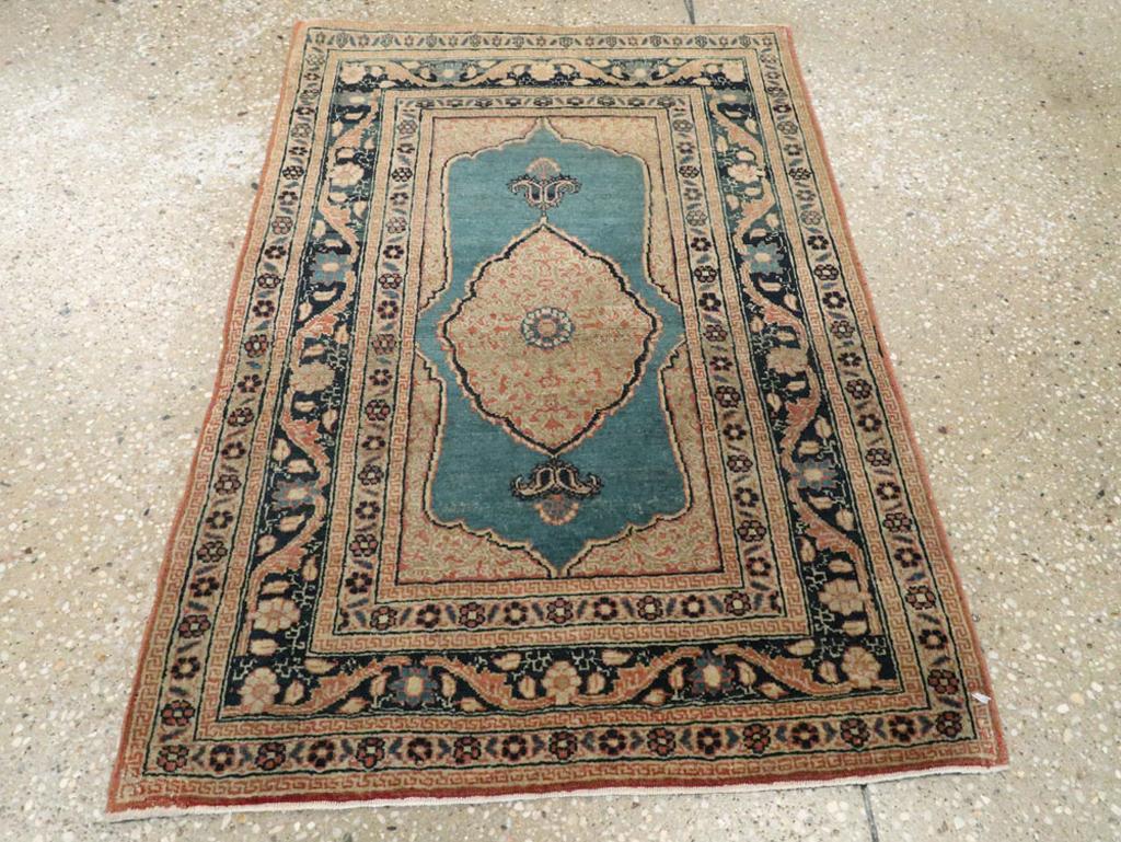 This early 20th-century Persian Tabriz Haji Jalili rug, measuring 1' 10