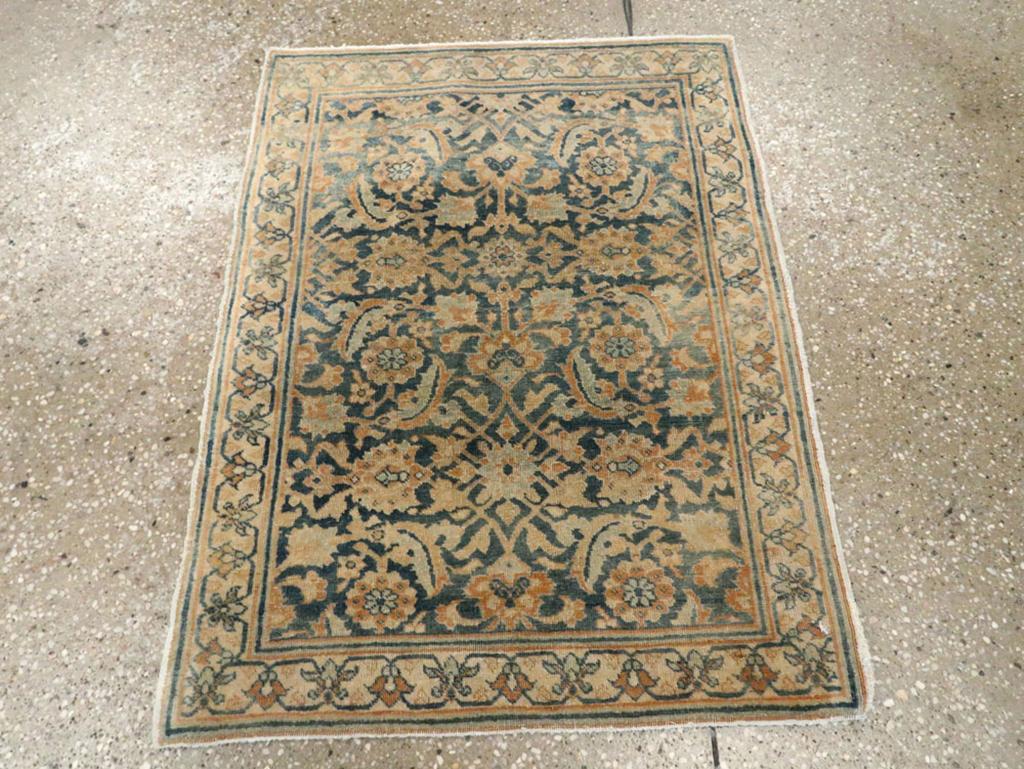 This early 20th-century Persian Tabriz Haji Jalili rug, measuring 1'11