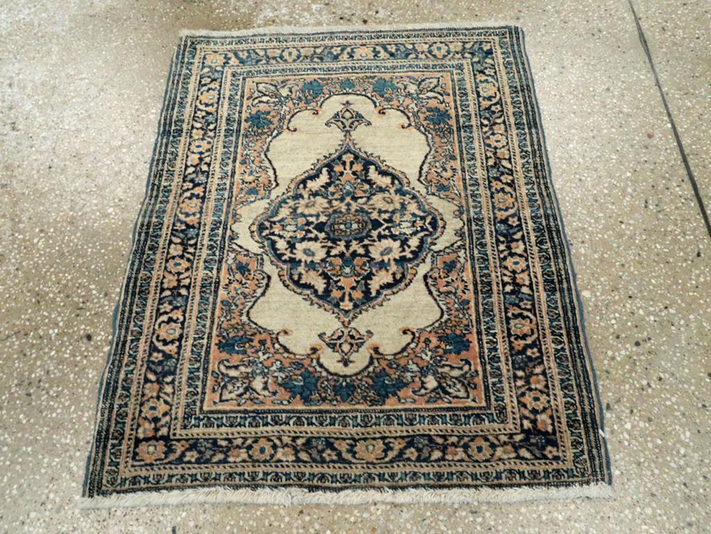 This early 20th-century Persian Tabriz Hagi Jalili rug, measuring 2'0
