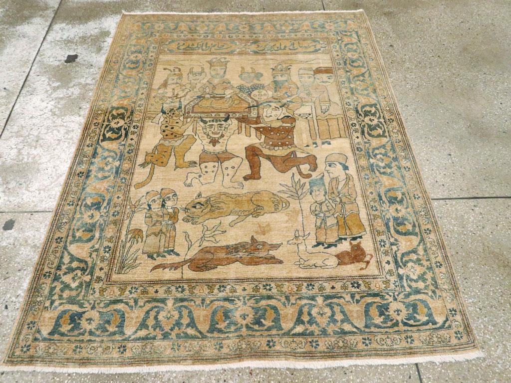 This Early 20th century Persian Tabriz pictorial rug, measuring 4' 5