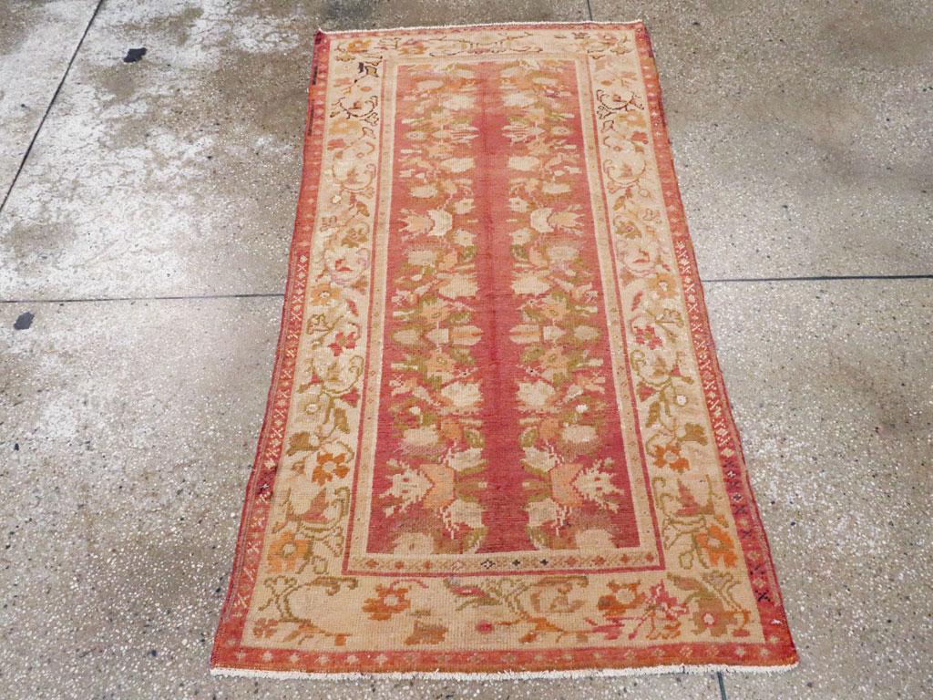 This early 20th century Turkish Oushak throw rug, measuring 2' 10