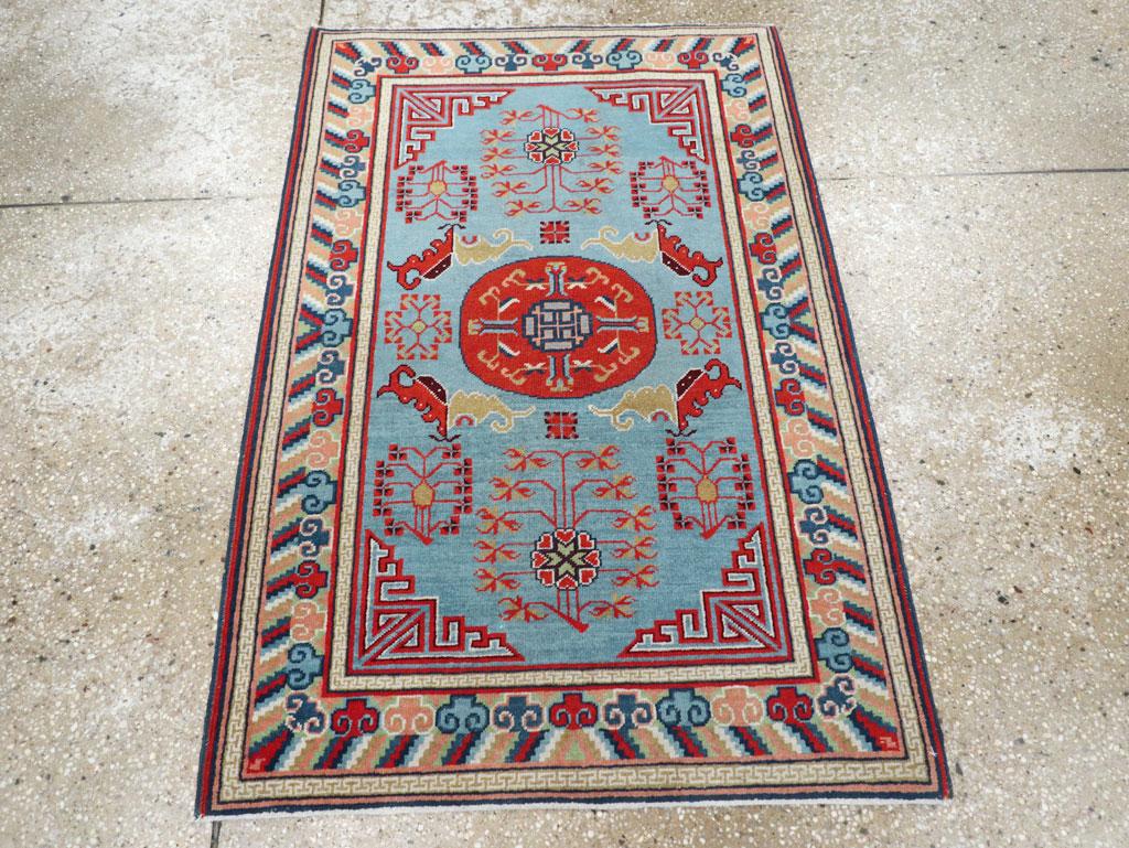 A vintage East Turkestan Khotan throw rug handmade during the Mid-20th Century.

Measures: 2' 7
