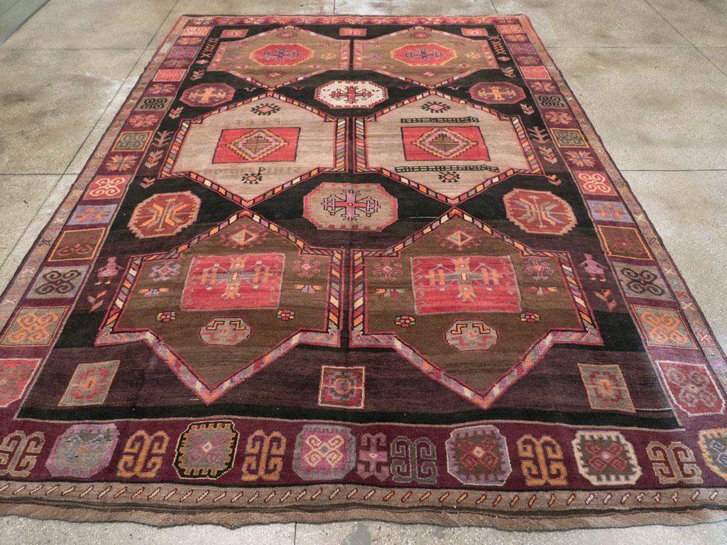 A vintage Turkish Anatolian tribal room size carpet handmade during the Mid-20th Century.

Measures: 9' 11