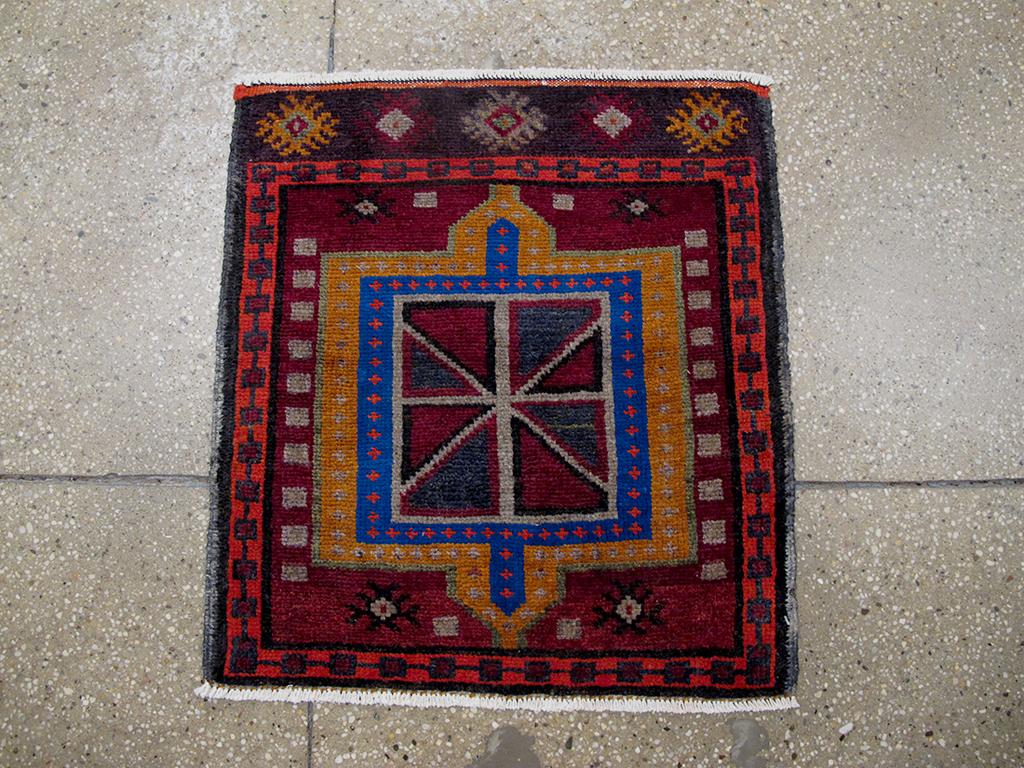 This mid-20th-century Persian Hamadan rug, measuring 2' 0