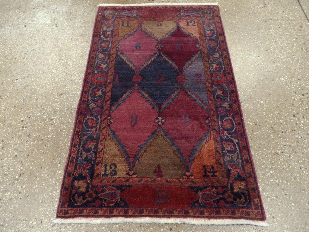 This mid-20th-century Persian Kashan rug, measuring 1' 9