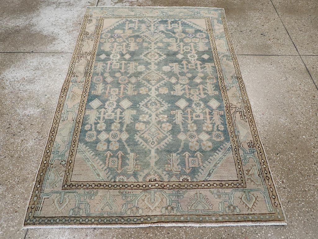 This Mid-20th century Persian Malayer rug, measuring 3' 6