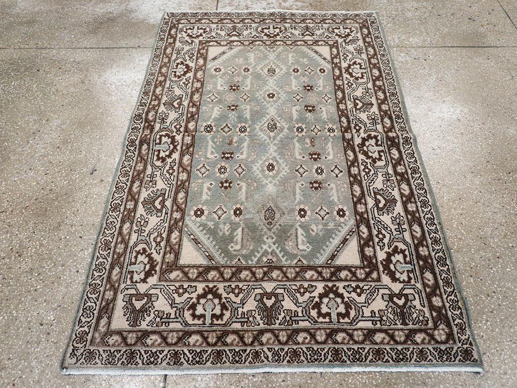 This Mid-20th century Persian Malayer rug, measuring 3' 6