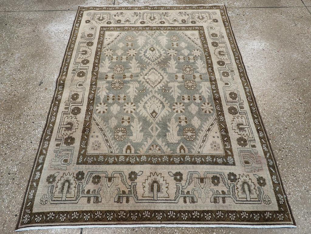 This Mid-20th century Persian Malayer rug, measuring 3' 7