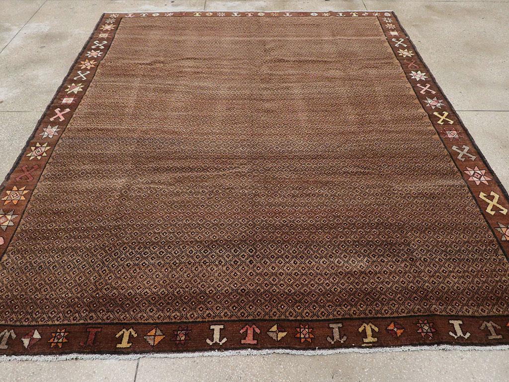 This mid-20th century Turkish Anatolian room-size carpet, measuring 8' 4