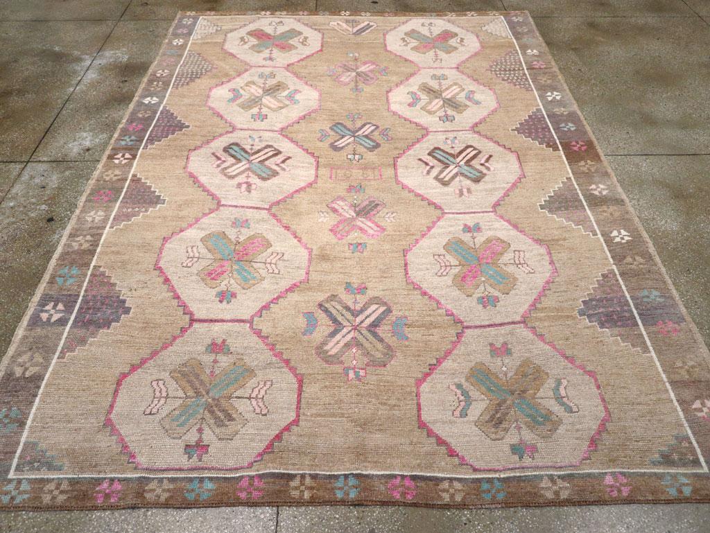 This mid-20th century Turkish Anatolian room-size carpet, measuring 8' 8