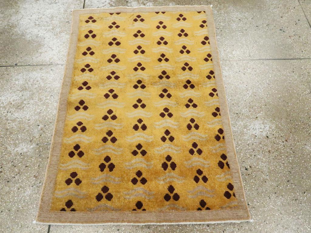 This mid-20th century Turkish Anatolian Deco rug, measuring 2' 11