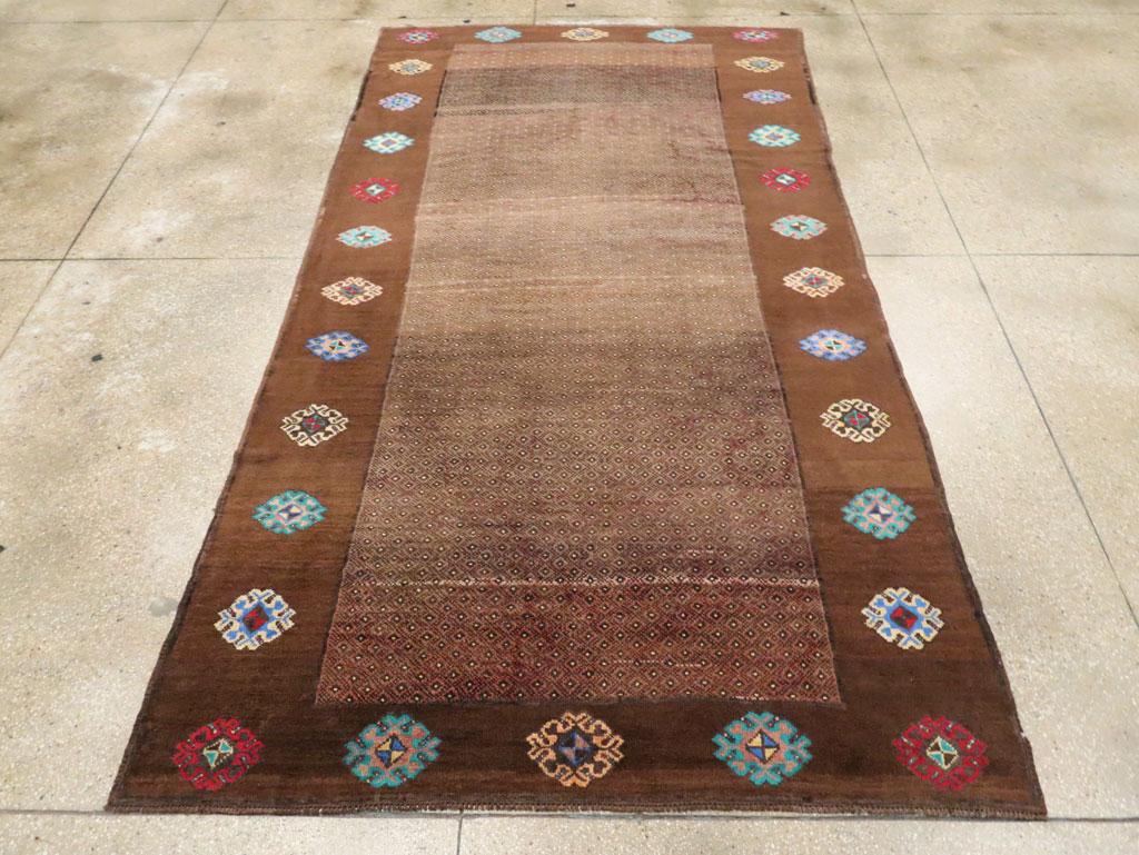 This mid-20th century Turkish Anatolian gallery carpet, measuring 5' 11