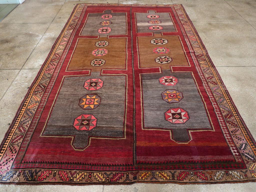 A vintage Turkish Anatolian tribal room size carpet handmade during the mid-20th century.

Measures: 9' 1