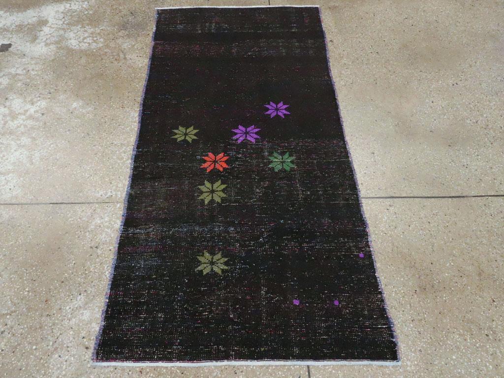 This mid-20th century Turkish Anatolian rug, measuring 2' 10