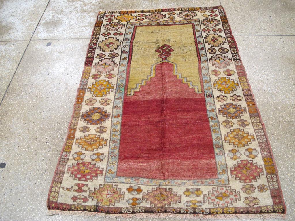 This early 20th century Turkish Anatolian rug, measuring 3' 5