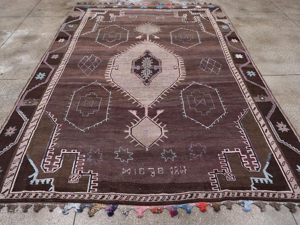 This striking Mid-20th century Turkish Anatolian tribal carpet, measuring 8' 9