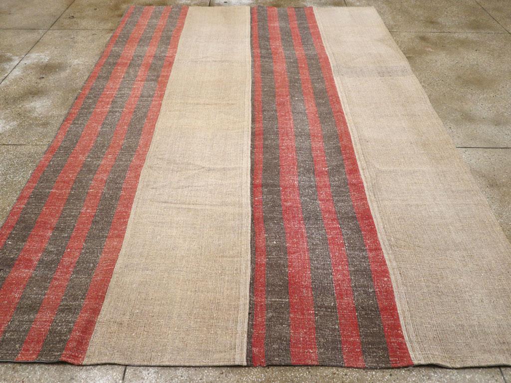 A vintage Turkish flatweave Kilim room Size carpet handmade during the Mid-20th Century.

Measures: 8' 5