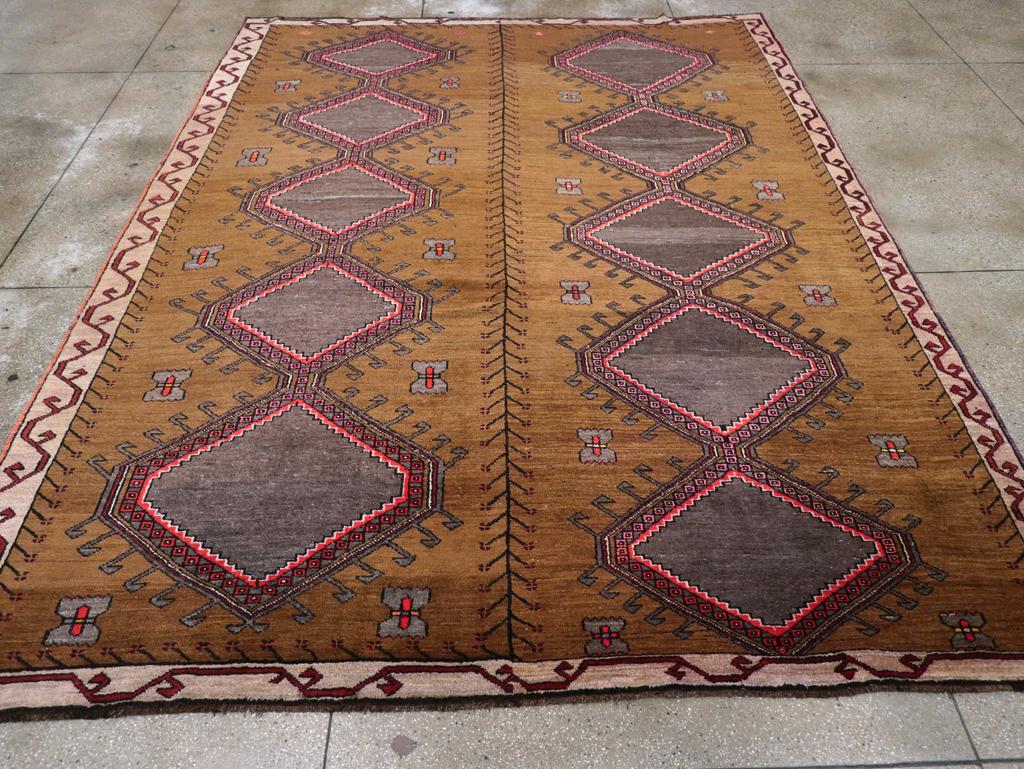 A vintage Turkish Anatolian tribal room size carpet handmade during the Mid-20th Century.

Measures: 9' 11