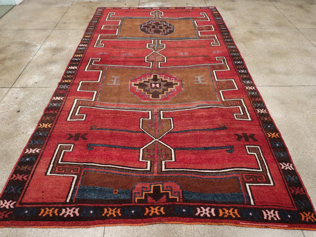 A vintage Turkish Anatolian long room size carpet handmade during the Mid-20th Century.

Measures: 8' 3