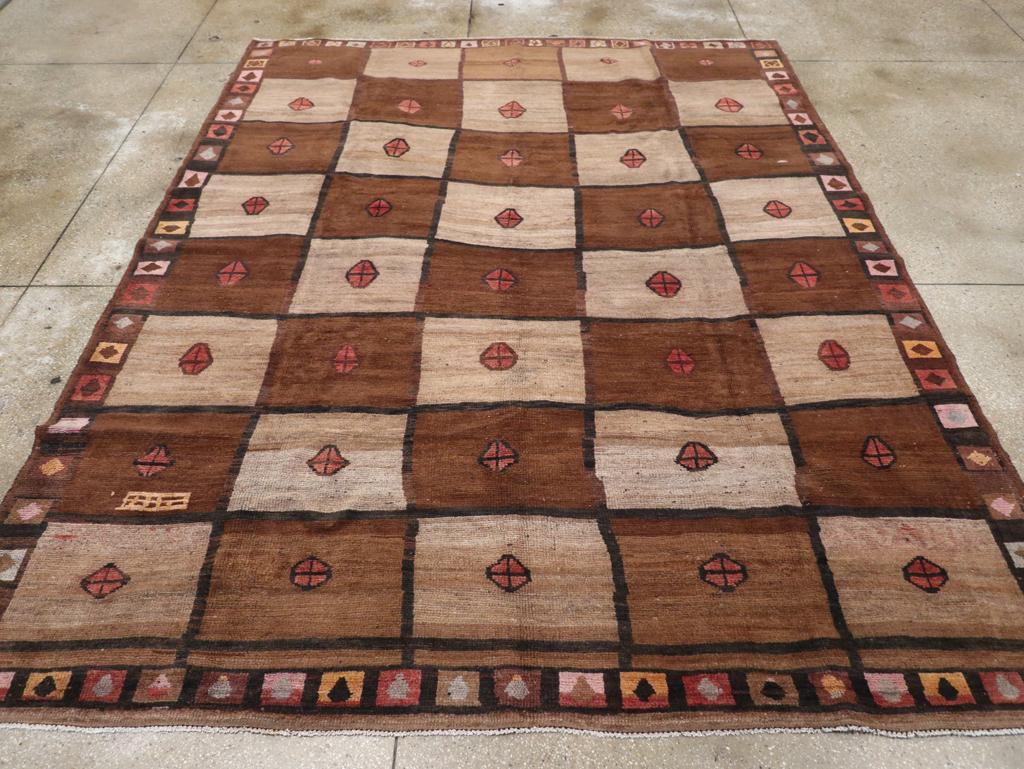 A vintage Turkish Anatolian tribal room size carpet handmade during the Mid-20th Century.

Measures: 9' 1