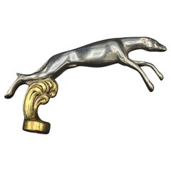 "Galgo" dog car mascot in mixed colors, from the 1960s