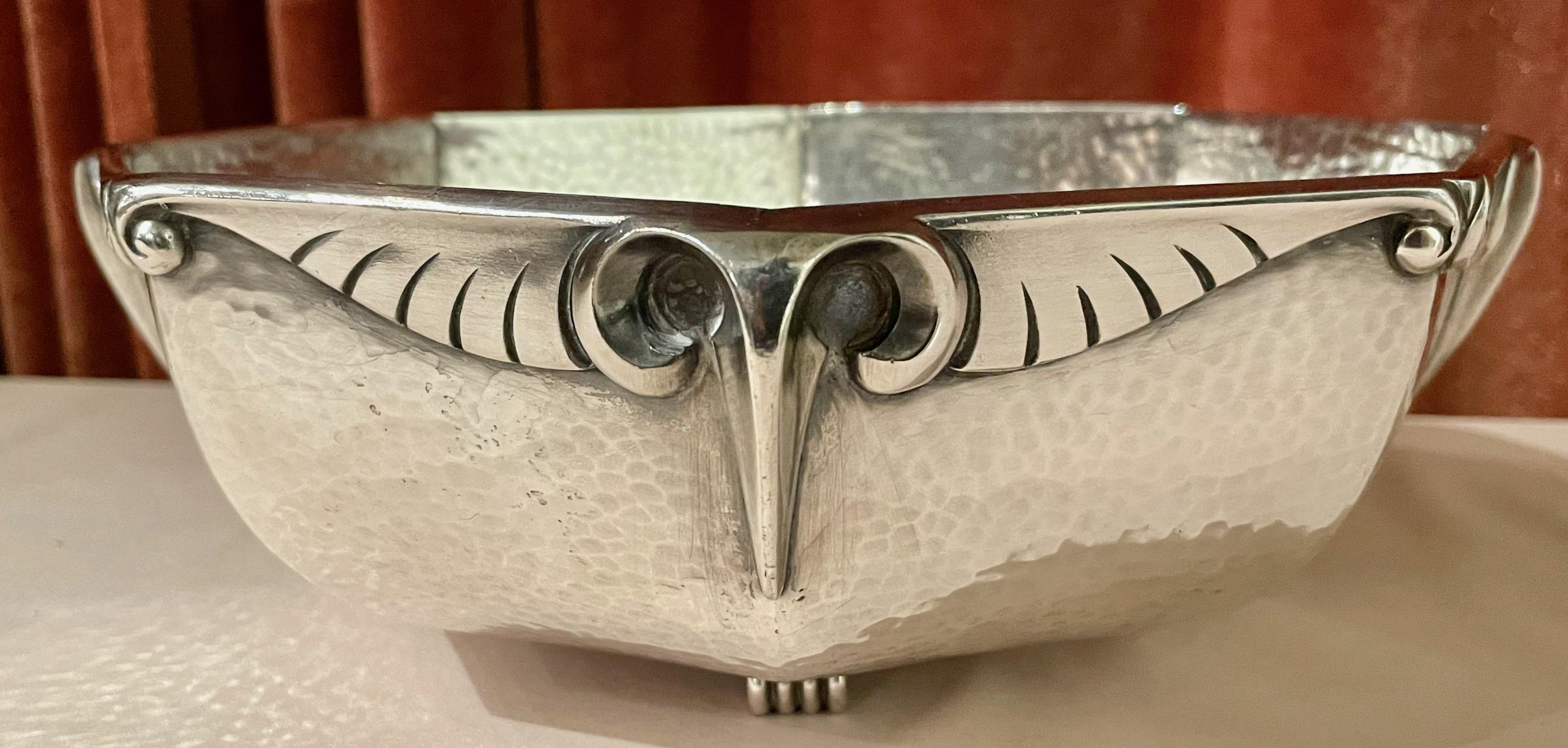 Galia silver plate bowl with stylized rams or bird head design repeated all around the 8 sided shaped bowl. Unique piece made of highest quality Christofle construction. An unusual finish that is hammered in the body and smooth in the details of the