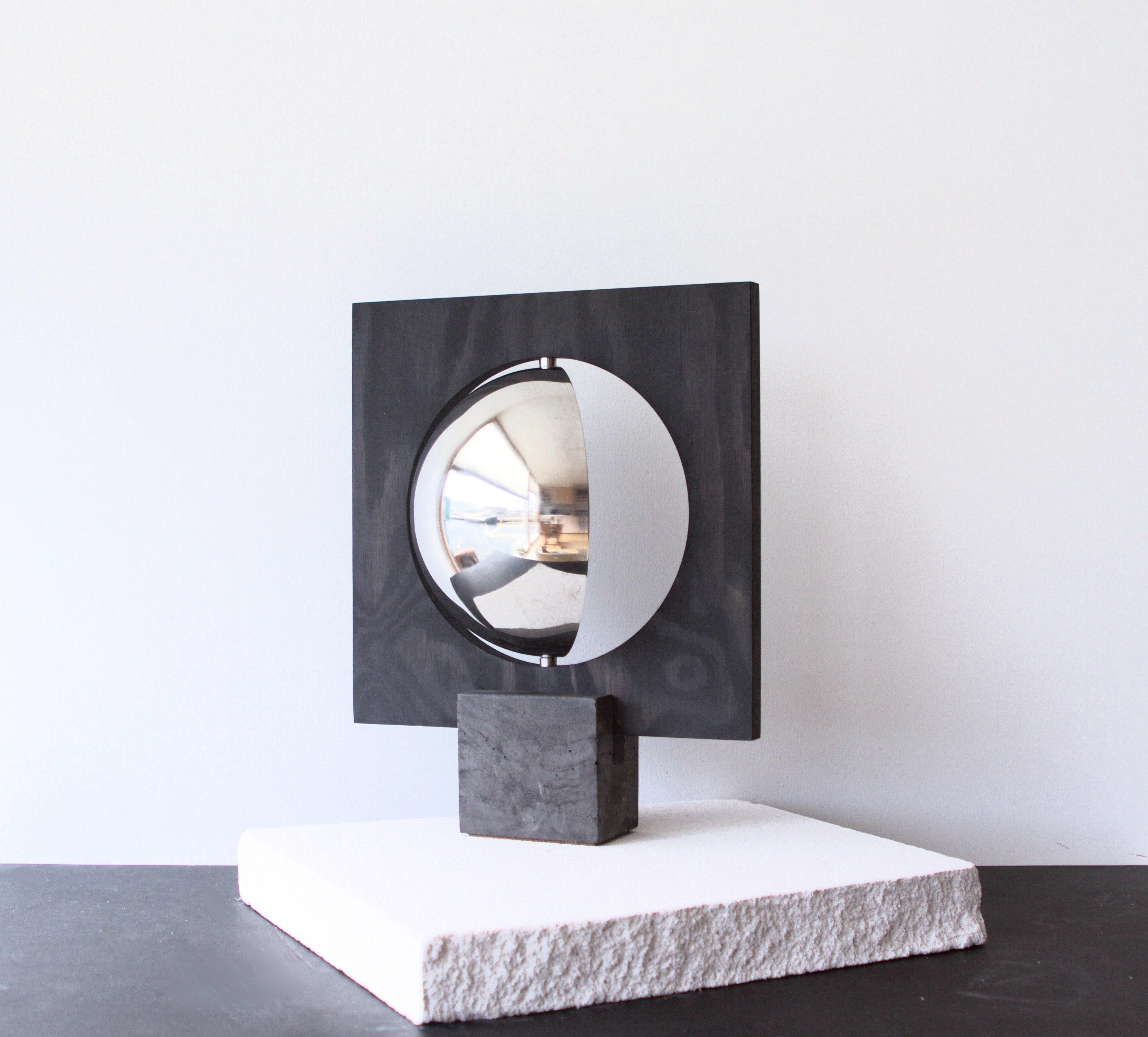 Galileo 2.0 Table Lamp by Edoardo Lietti Studio
Unique Piece
Dimensions: D 10 x W 30 x H 38 cm.
Materials: Black pigmented concrete, birch plywood, and polished stainless steel.
Weight: 3,5 kg.

All our lamps can be wired according to each country.