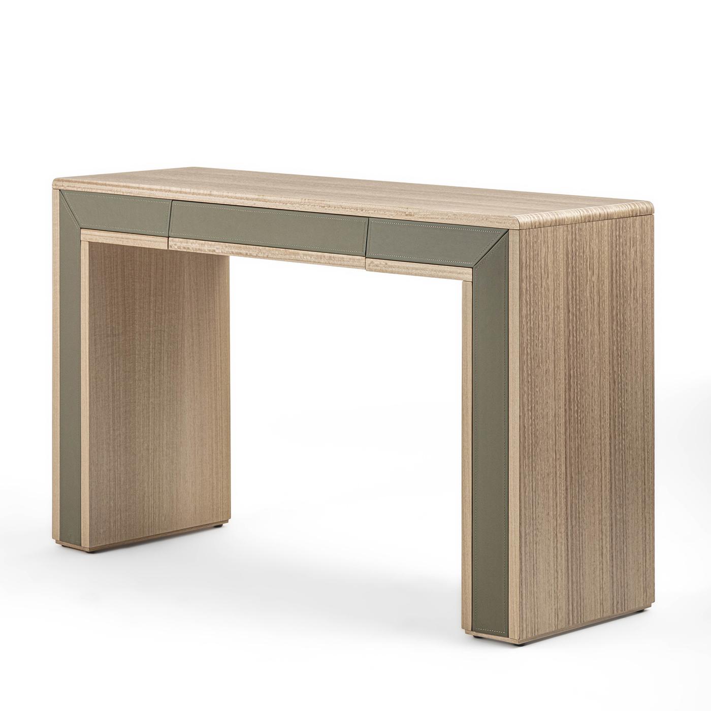 An essential structure recalling a trilithon characterizes this sophisticated minimalist console by Giuseppe Carpanelli. A delicate combination of materials and chromatic contrasts marks the silhouette, fashioned of eucalyptus wood with fine leather