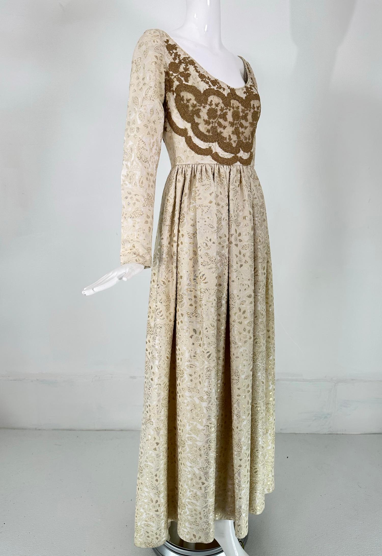 Irene Galitizne Couture, Renaissance style evening gown in cream & white with gold metallic brocade from the 1970s. A romantic gown with a beautiful neckline and bodice front applique design. Low scooped neckline, the bodice is appliqued with a gold