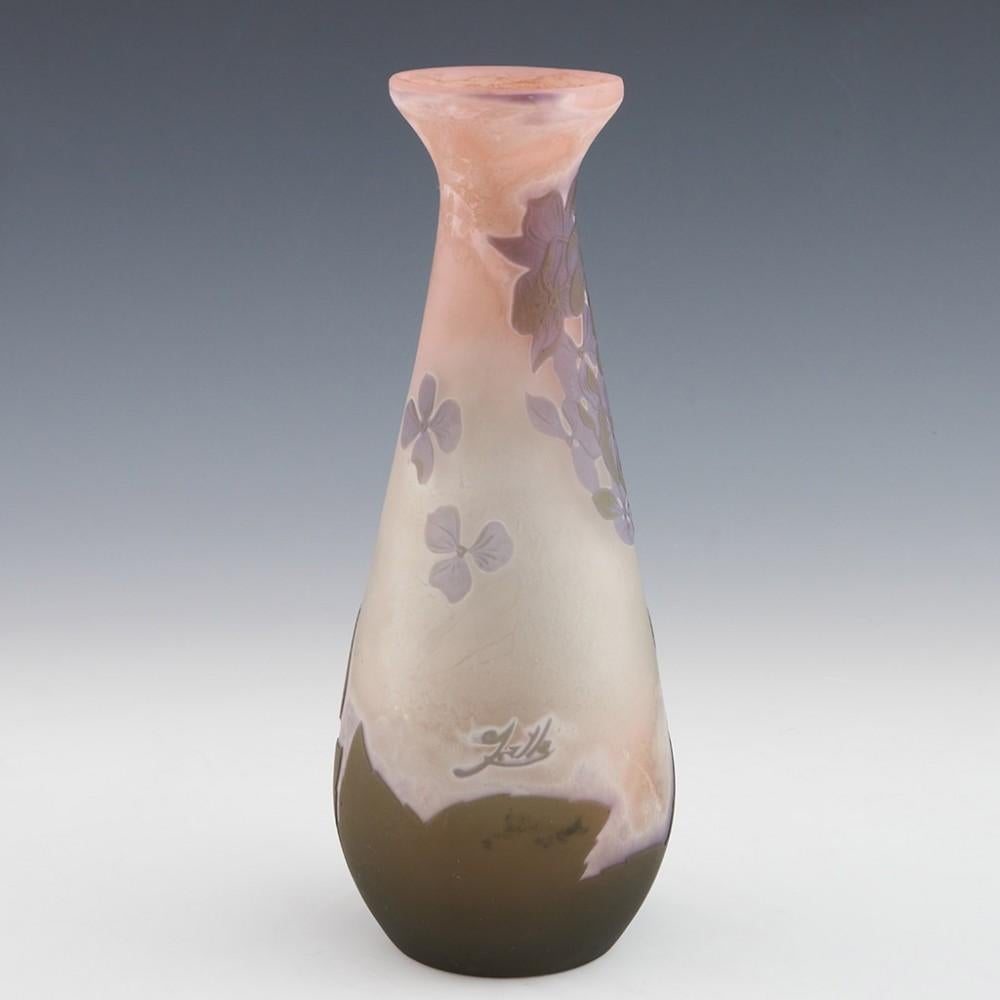 Heading : Galle Cameo Hydrangeas Vase c1910
Date : c1910
Origin : nancy, France
Bowl Features : Hydrangea flowers and leaves in two colour high relief over a mauve, white, peach and clear frosted ground
Marks : Galle cameo signature
Type : Lead