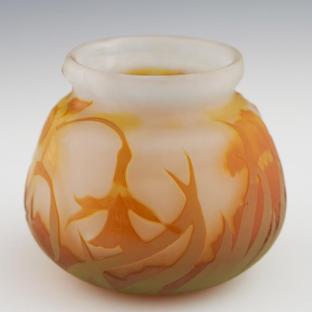 Heading : Emile galle cameo glass vase depicting daffodils
Date : c1910 - form of the Gallé signature used between 1906 and 1914
Origin : Nancy, France
Bowl Features : Of squat form with everted rim. Varying shades of yellow and orange against a