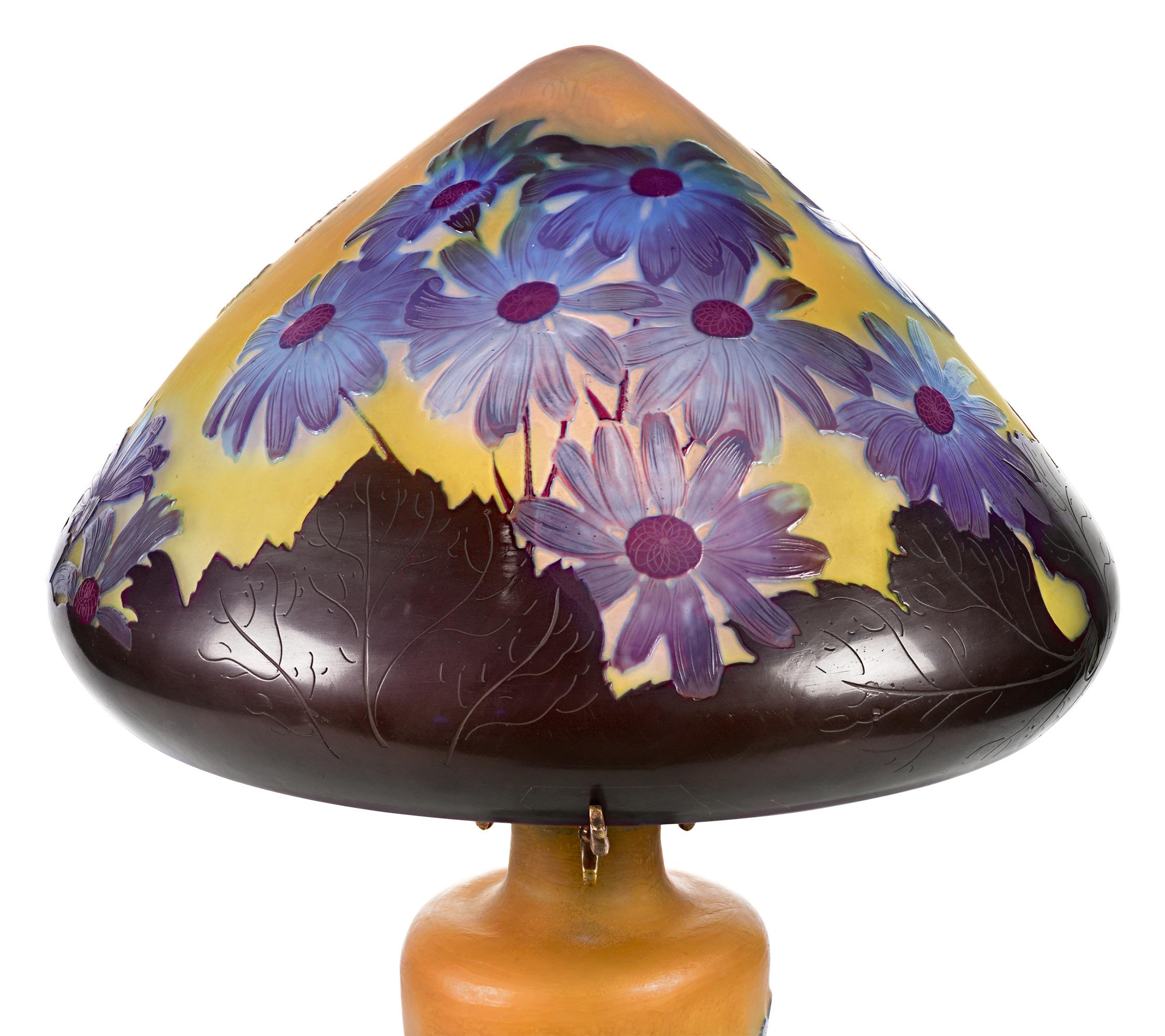 Statuesque and artfully etched, this exquisite cameo glass table lamp is the work of the famed Art Nouveau master Émile Gallé, one of the most highly regarded names in French glassmaking. The artist's appreciation of nature is on full display in the