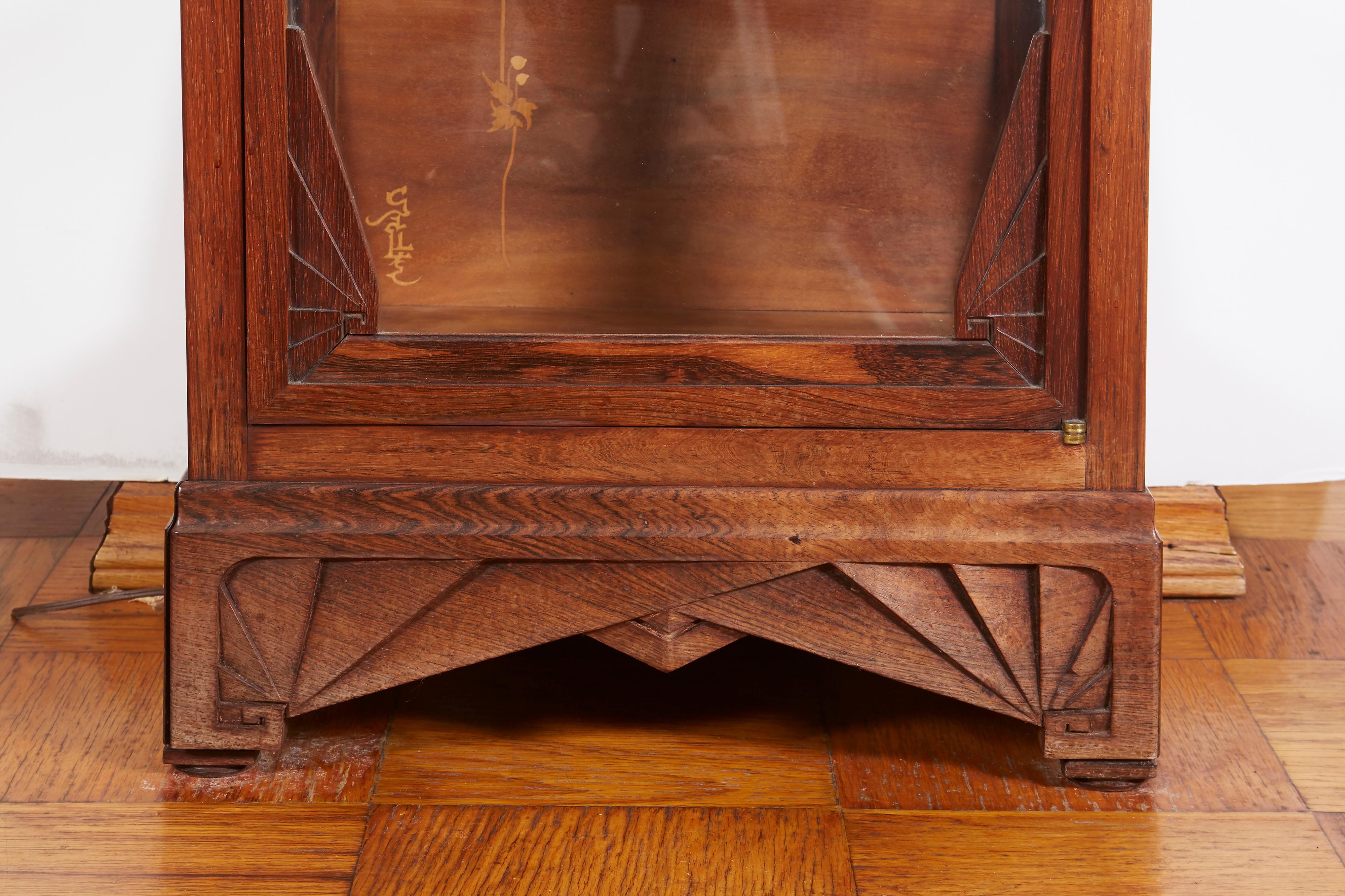 French Art Nouveau inlaid vitrine by Emille Galle, signed.
Measures: Width 19