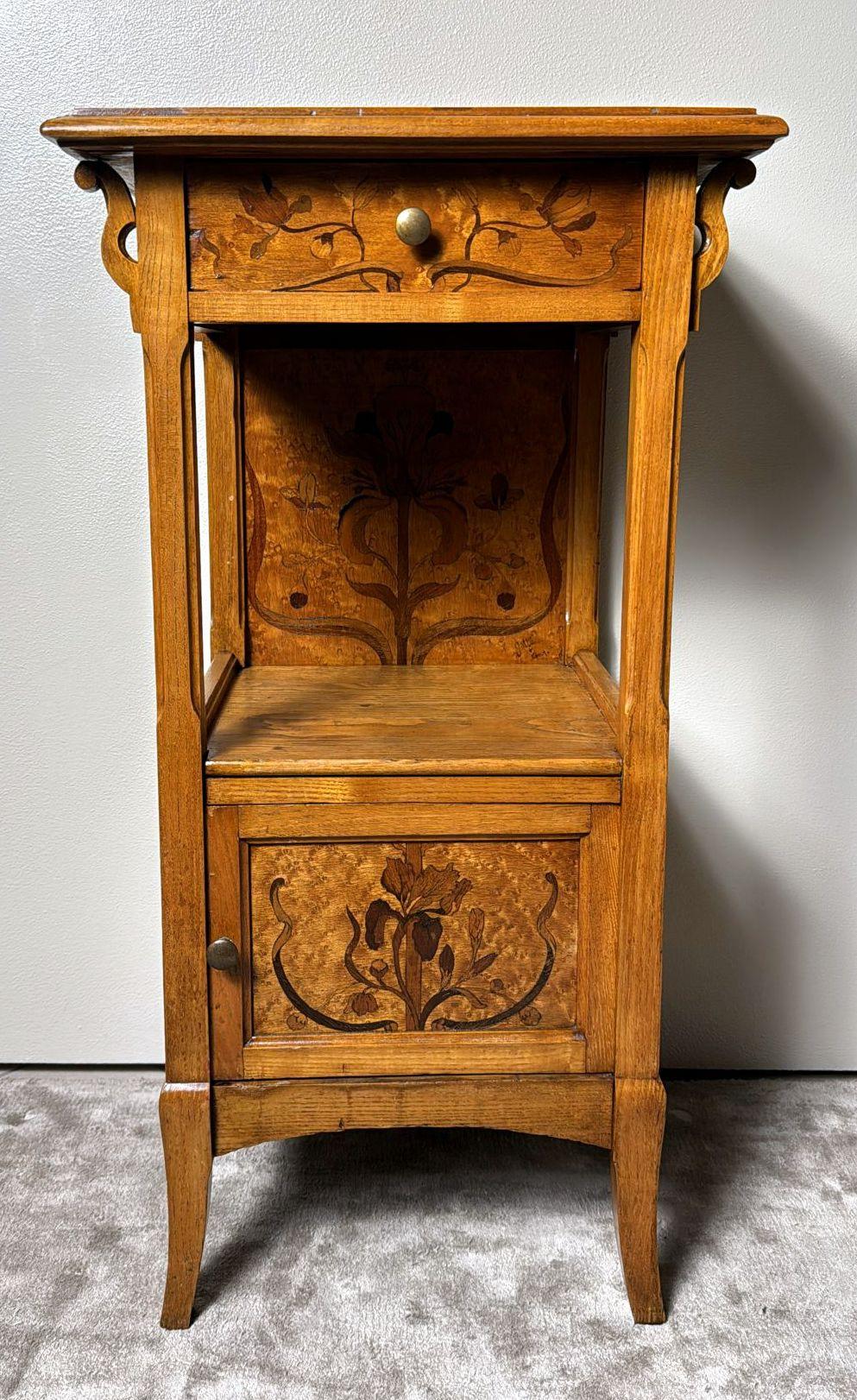 We kindly ask that you read the entire description, as we strive to provide detailed technical and historical information to guarantee the authenticity of our items. This exquisite nightstand, crafted by the renowned Art Nouveau master Émile Gallé,