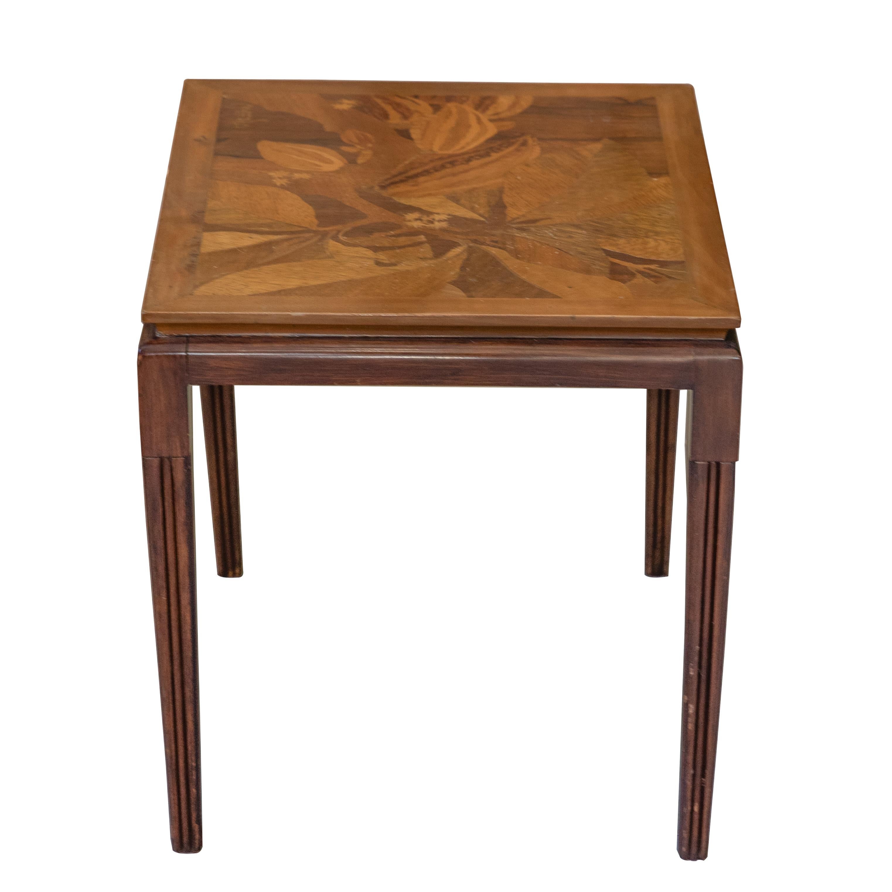 Emile Gallé inlaid early 20th century Art Nouveau side table with floral and foliage motifs. French designer Emile Gallé is considered to be one of the driving forces behind the Art Nouveau movement. His artwork lives on in almost every museum