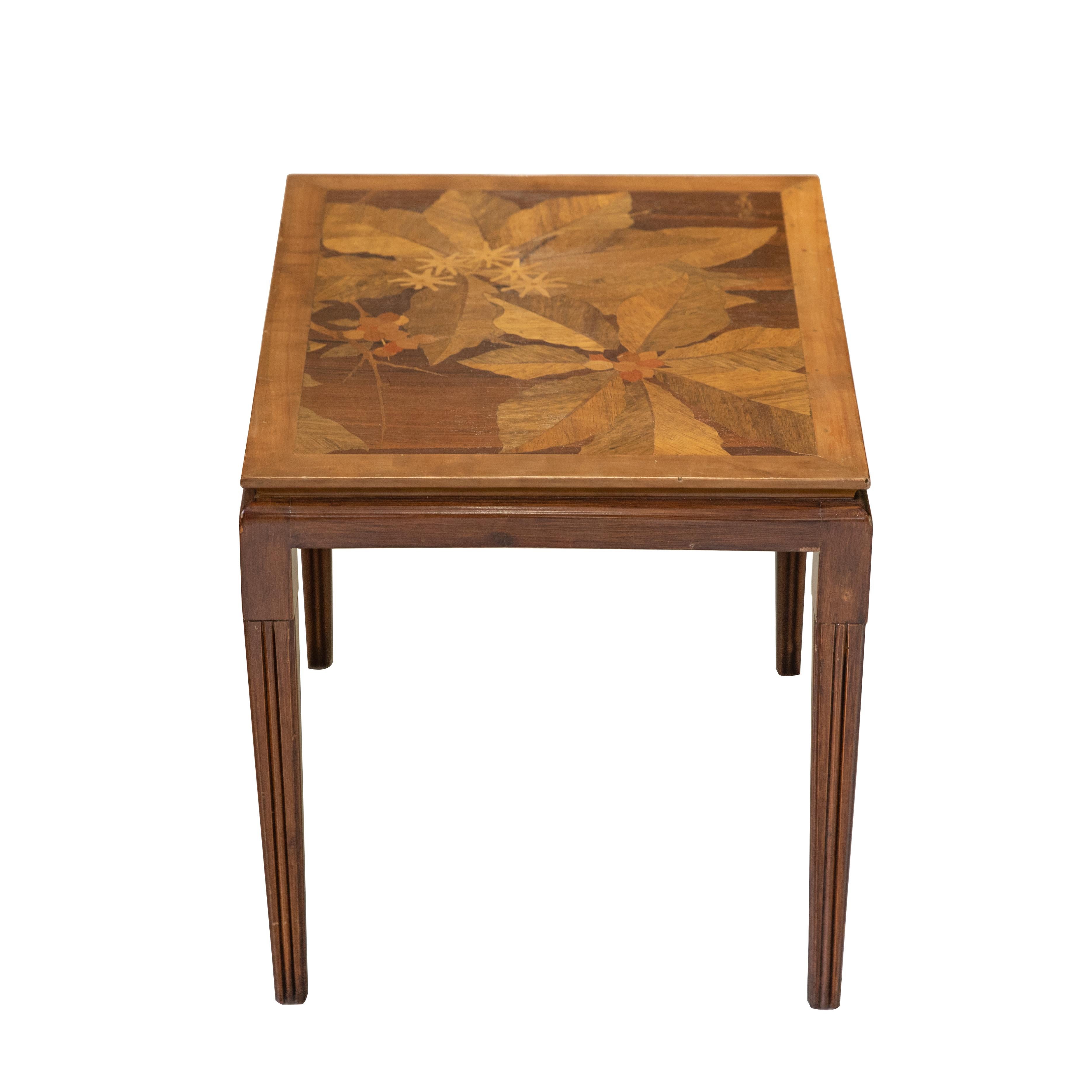 Emile Gallé inlaid early 20th century art nouveau side table with floral and foliage motifs. French designer Emile Gallé is considered to be one of the driving forces behind the Art Nouveau movement. His artwork lives on in almost every museum