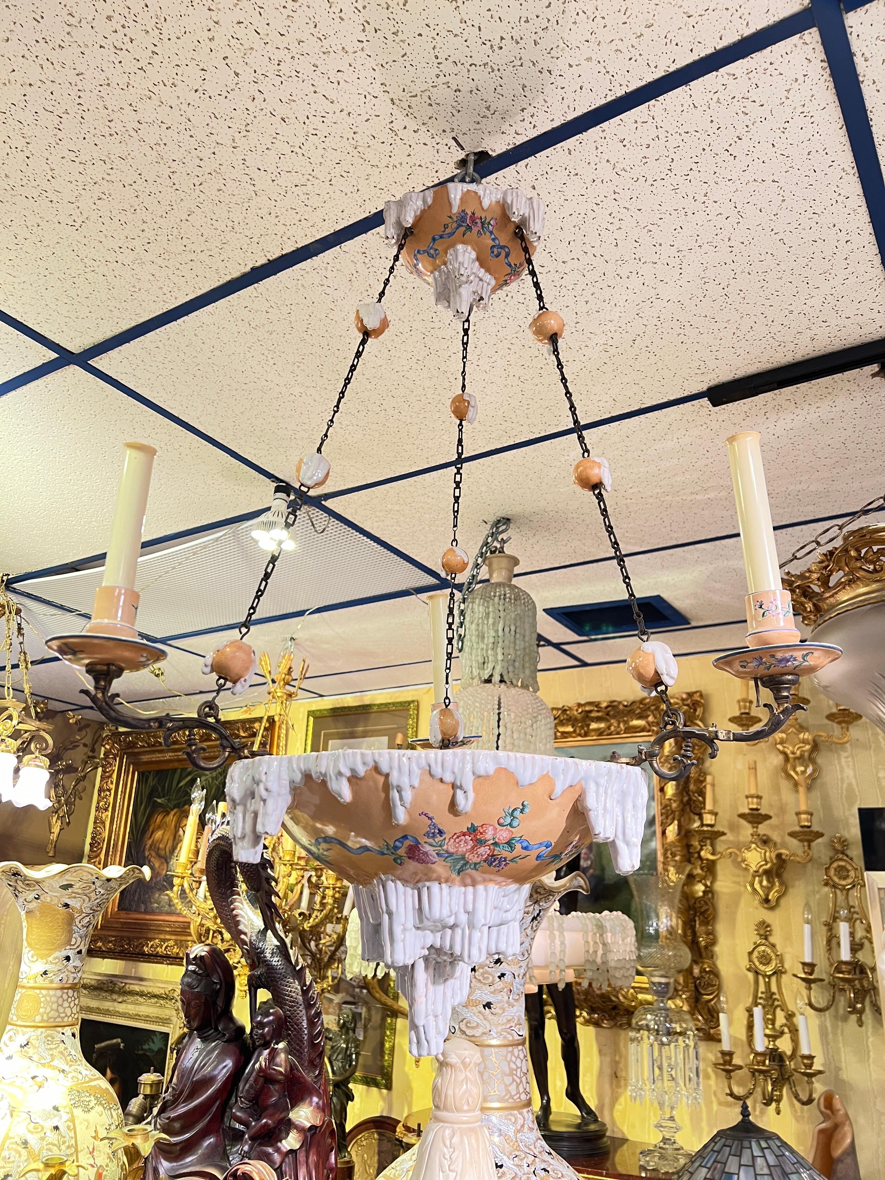 Very rare and unusual antique (late 19th century) glazed faience ceramic chandelier with three bronze candle arms by Galle of Nancy, France, with icicle motif and transfer printed floral swags.  Signed Galle Nancy.  With later candelabra size