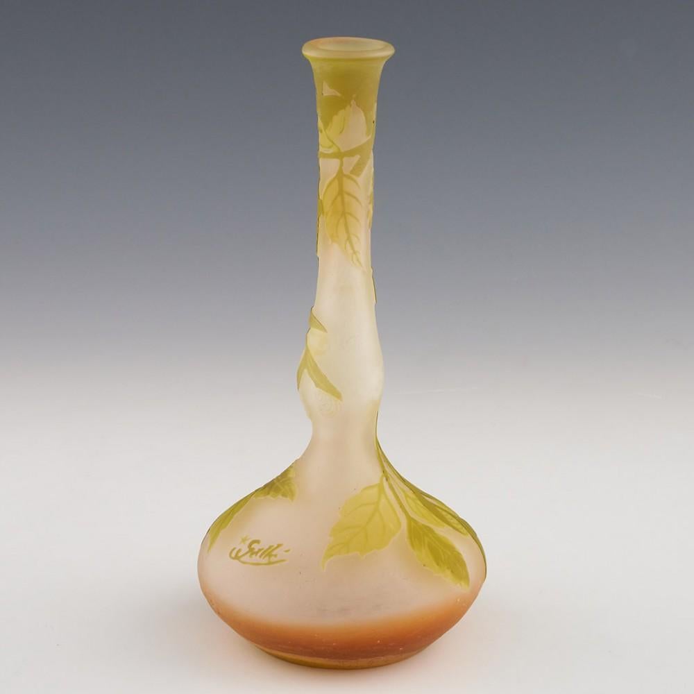 Heading : Galle cameo vas
Date : 1904-06
Origin : nancy, France
Bowl Features : Sycamore type foliage depicted in salmon pink overlaid in green
Marks : *Galle cameo siganture - only used between 1904 and 1906
Type : Lead
Size : 17cm height, 8cm