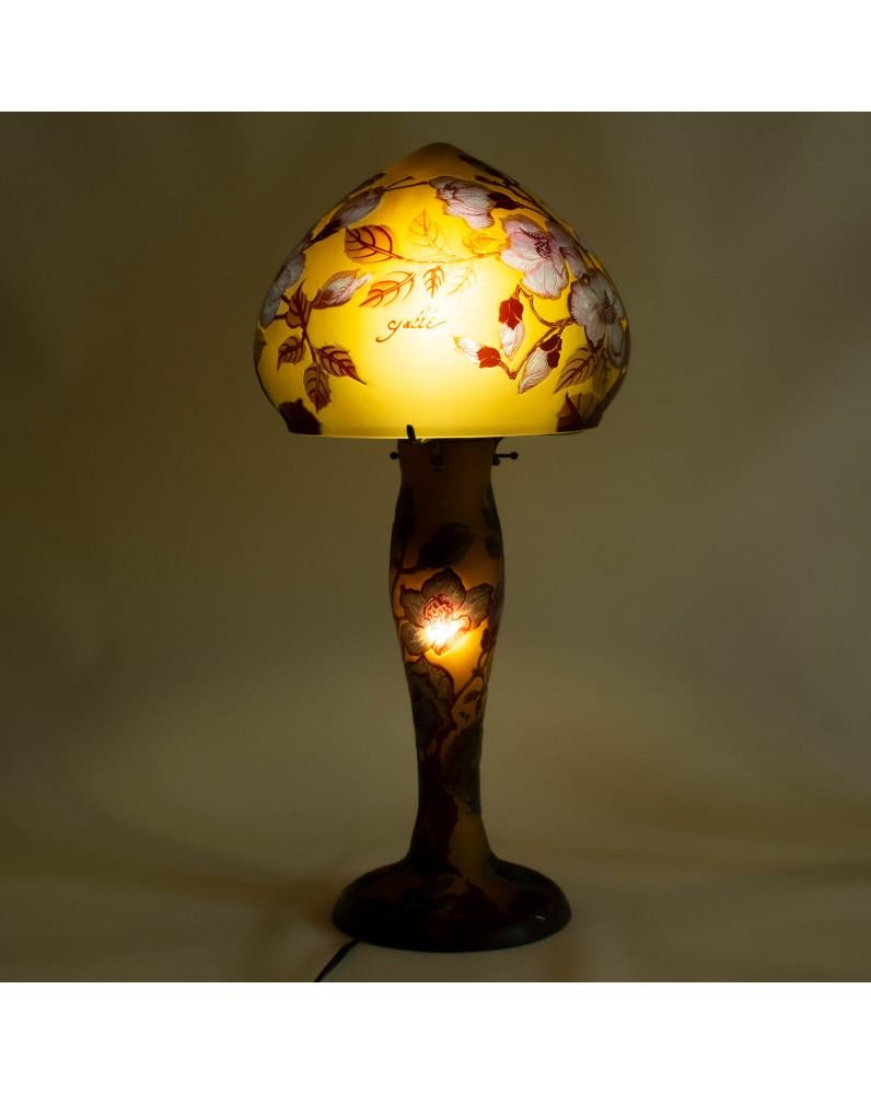 Superb Large Mushroom Lamp in multilayer glass decorated with flowers, tones of blue on an ocher background. Height: 53cm.  Lamp signed “Gallé”, accompanied by a “Tip” distinction.  The sale of these copies is authorised by the House of Gallé and