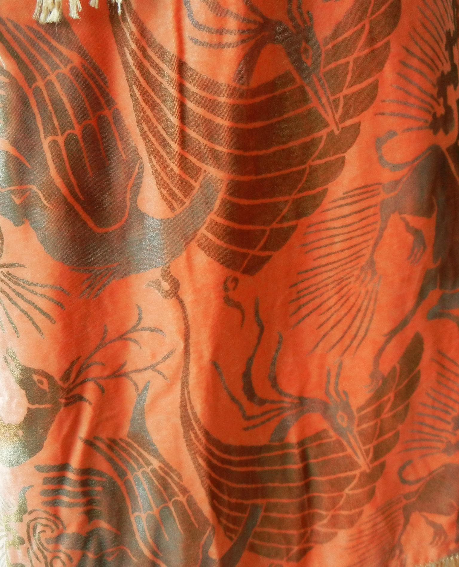 A rare stunning rich apricot panne velvet Gallenga fringed shawl circa 1920's. 

The textile art of Maria Monaci Gallenga is often compared to that of Mariano Fortuny because they both produced hand-stenciled designs that drew inspiration from the