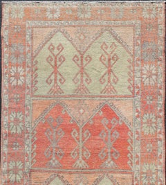 Vintage Turkish Oushak Rug with Soft Coral, Sage Green, and Muted Orange Tones