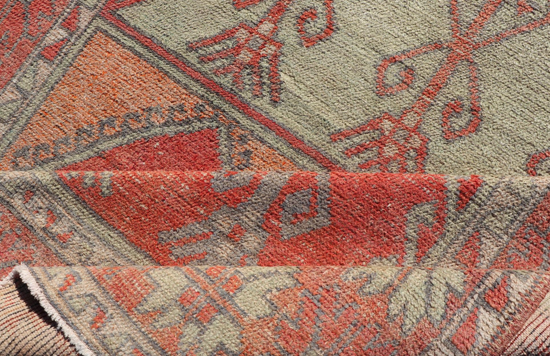 Wool Gallery Rug, Vintage Turkish in Faded Red, Coral, Orange, Soft Pink and Green For Sale