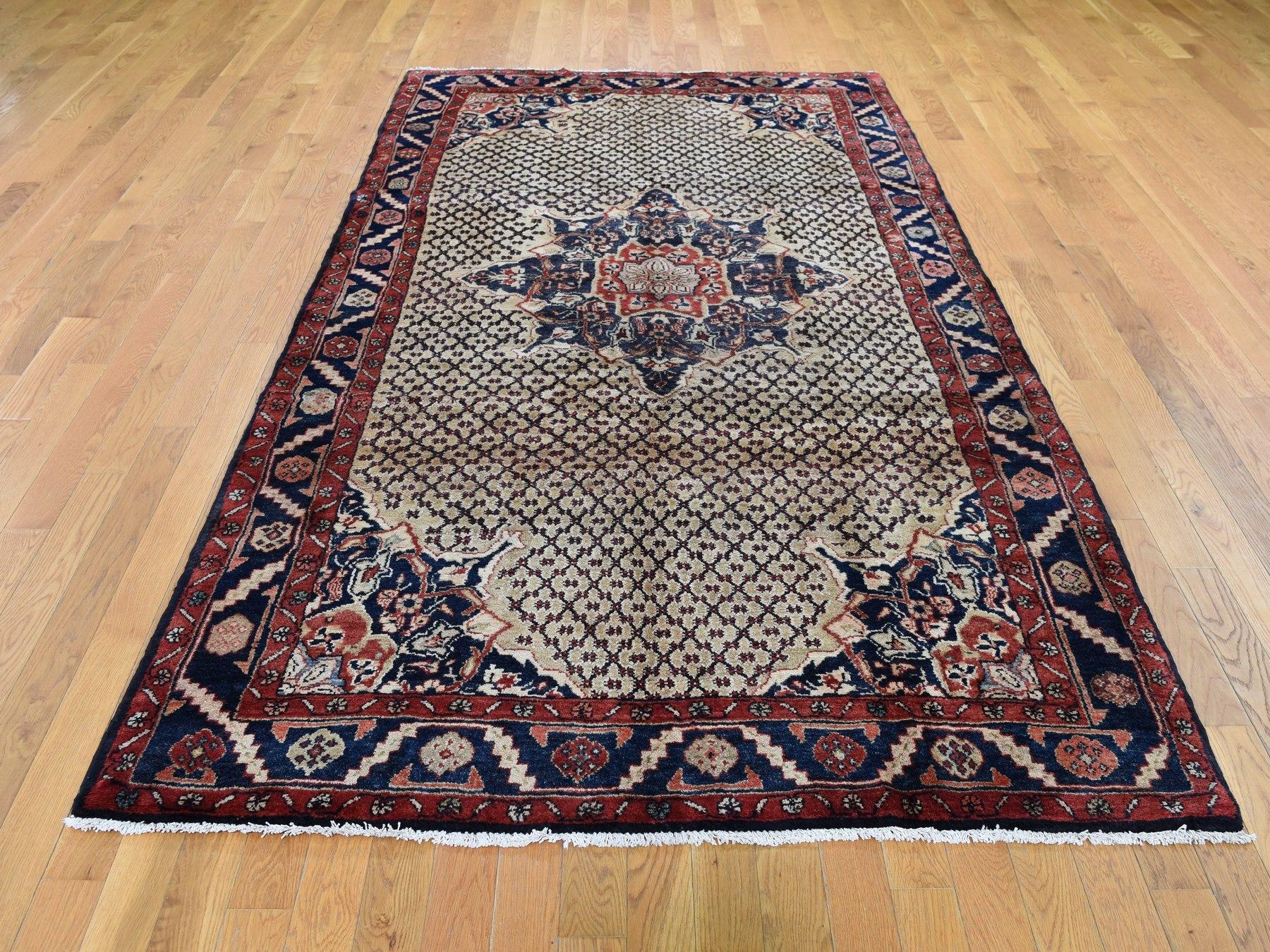 This is a truly genuine one-of-a-kind gallery size vintage Persian Hamadan camel hair hand knotted rug. It has been knotted for months and months in the centuries-old Persian weaving craftsmanship techniques by expert artisans. 

Primary materials: