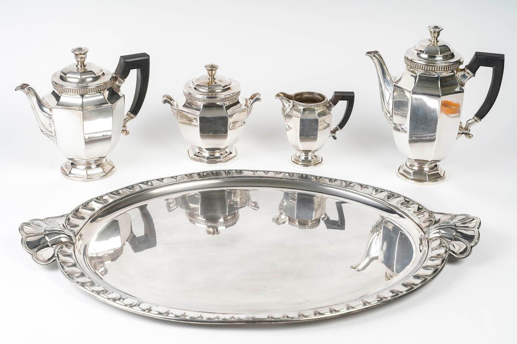 Gallia silver plated tea or coffee service.

Gallia silver plated tea or coffee service, 5 pieces, micro scratches from use, circa 1930, Art Deco.
h: 21cm, w: 60cm, d: 40cm