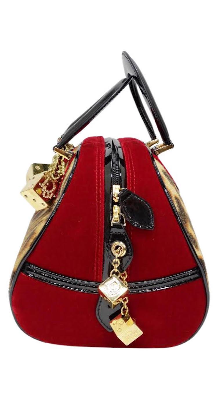 How wild is this Christian Dior handbag?! This stunning Galliano for Christian Dior handbag from 2004 Fall runway is made from pony hair and complete with luxe deep red velvet/ velour with black patent leather trim. Complete with gold hardware and