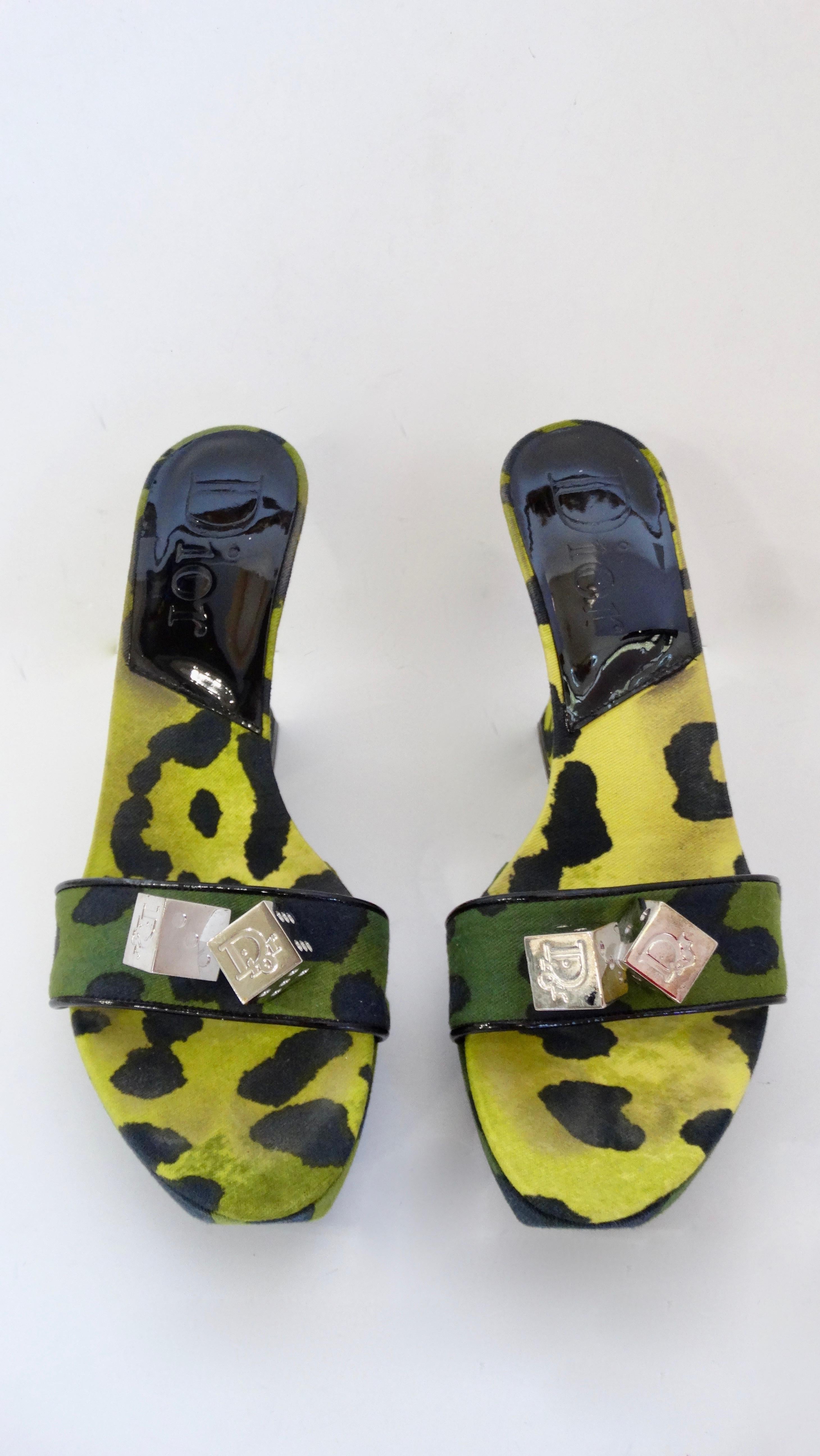 Elevate your looks with these amazing Galliano for Dior wedges! Circa 2000s, these wedges feature an asymmetrical heel, a two-tone green leopard print and two pairs of silver toned Dior dice on the strap. A true statement piece, these shoes are