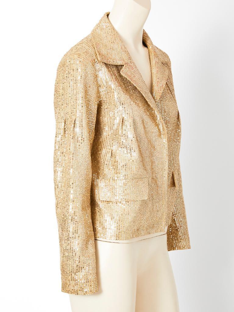 John Galliano for Dior, beige suede, structured, cropped jacket having a notched collar, hidden, large, gold tone, snap closures and two front, flap pockets. Jacket is entirely encrusted with gold tone sequins.