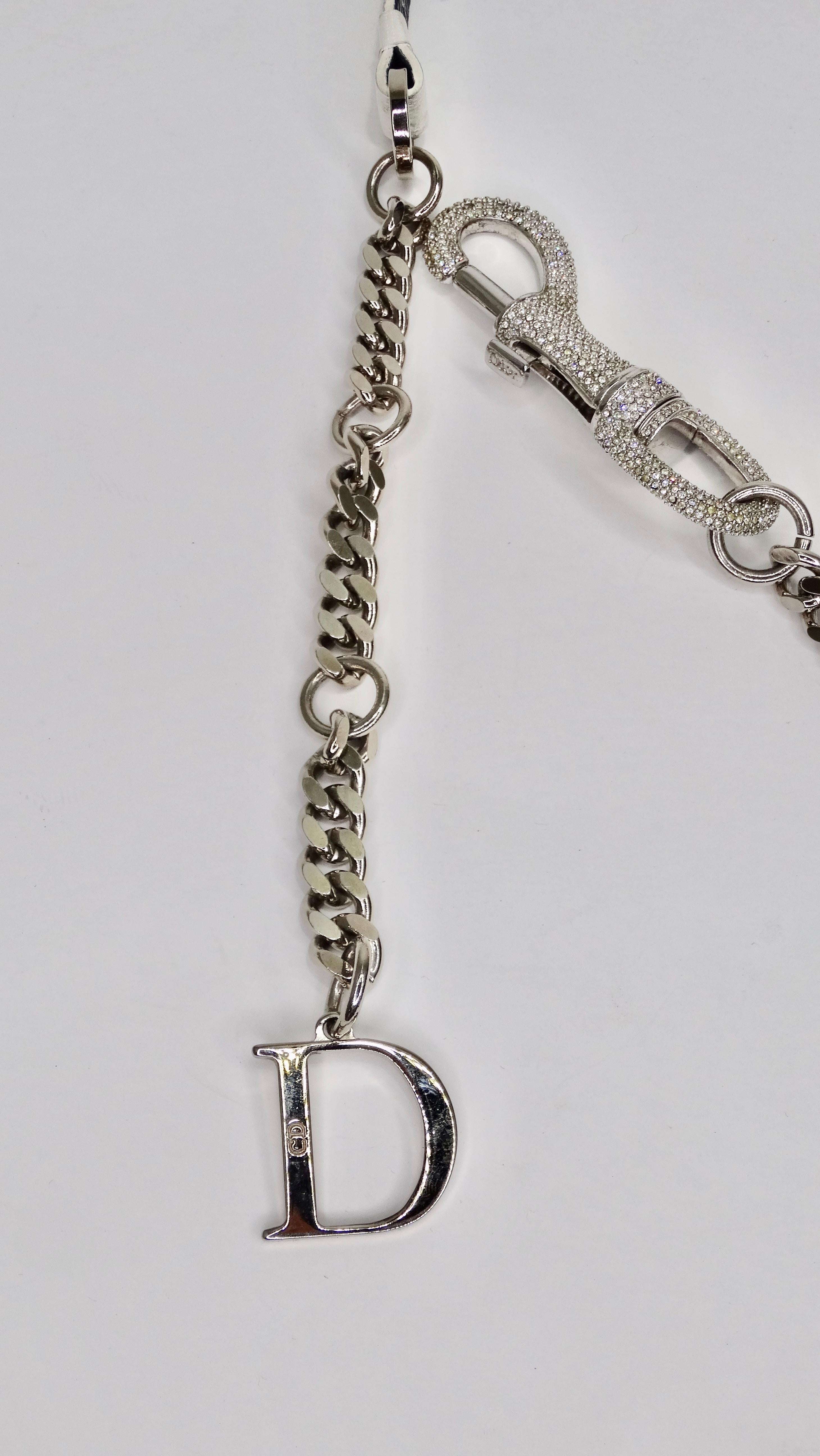 How adorable is this Dior belt?! Stunning Galliano for Christian Dior belt circa 2003 features white leather with a silver chain and Dior plaque. Adjustable rhinestone carabiner closure with a single 'D' charm. Made in Italy. A true vintage show