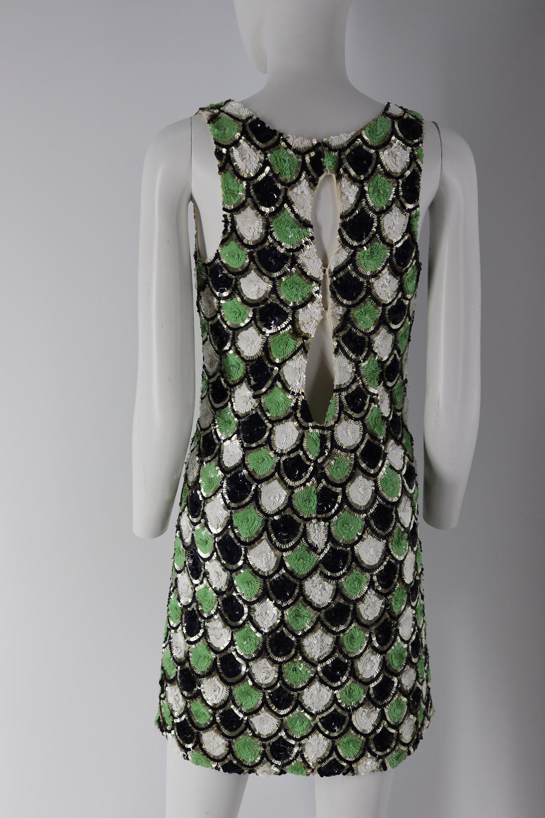 

Galliano Green Black And White Dress Sequins

- The materials used are : Sequins green, black and white.

- The mains colors on this are green, black and white.

- The back is slightly open.

- Excellent condition, shows some light signs of use